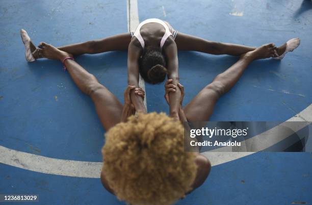 Ballet class in Morro do Adeus Favela of Rio de Janeiro in Brazil on November 24. Barefoot dancers, girls from Morro do Adeus Favela, overcome...