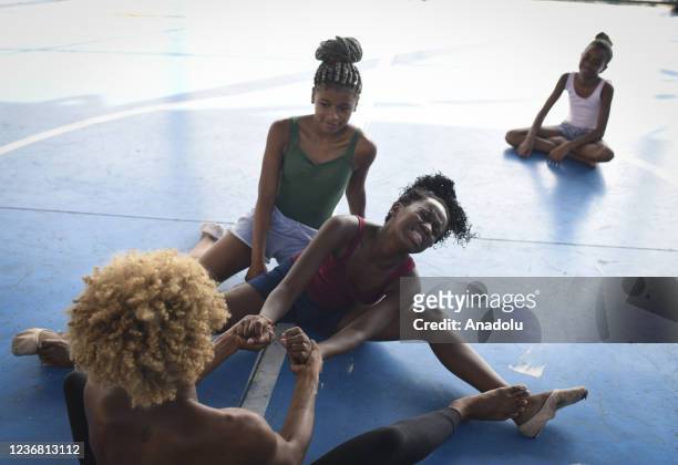 Ballet class in Morro do Adeus Favela of Rio de Janeiro in Brazil on November 24. Barefoot dancers, girls from Morro do Adeus Favela, overcome...