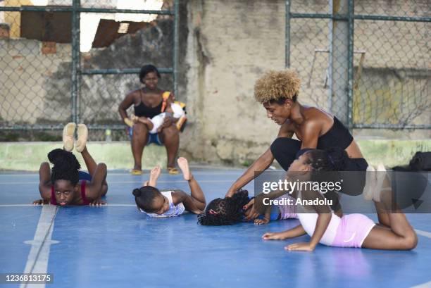 Ballet class in Morro do Adeus Favela of Rio de Janeiro in Brazil on November 24. Barefoot dancers, girls from Morro do Adeus Favela, overcome...