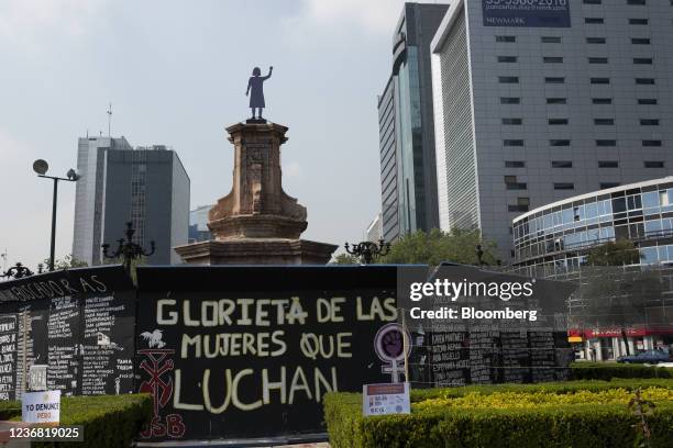 Temporary statue of a women placed where a statue of Christopher Columbus once stood ahead of a protest on the International Day for the Elimination...