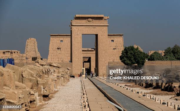 This picture taken on November 26, 2021 shows a view of the Avenue of the Sphinxes outside the South Gate of the Temple of Karnak in Egypt's southern...