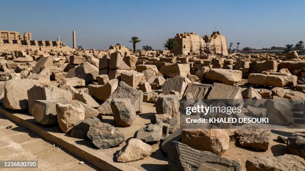 This picture taken on November 26, 2021 shows a view of building fragments on display outside the Temple of Karnak in Egypt's southern city of Luxor....