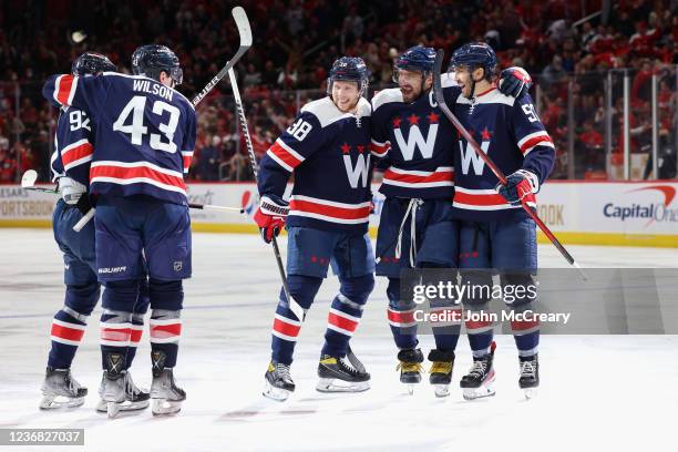 The Washington Capitals celebrate a goal by Alex Ovechkin during a game against the Florida Panthers at Capital One Arena on November 26, 2021 in...