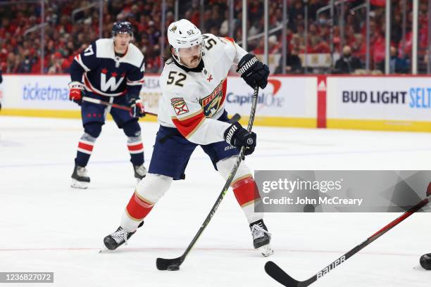 MacKenzie Weegar of the Florida Panthers takes a shot on net during a game against the Washington Capitals at Capital One Arena on November 26, 2021...