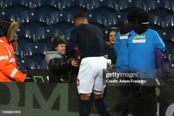 Matt Phillips of West Bromwich Albion gives his match shirt to a young West Bromwich Albion Fans after the Sky Bet Championship match between West...