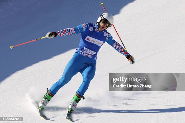 Sergey Ridzik of Russia celebrates after crossing the finish line to win the Men's Ski Cross semifinals of Audi FIS Cross World Cup 2022 at Genting...