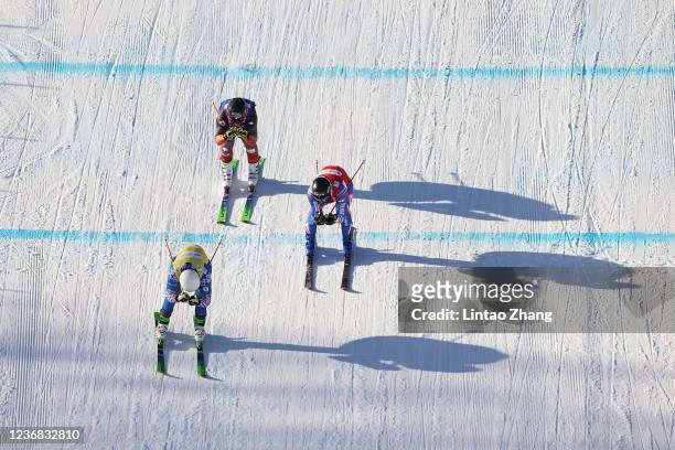 Brady Leman of Canada, Sergey Ridzik of Russia and Bastien Midol of France compete in the Men's Ski Cross finals of Audi FIS Cross World Cup 2022 at...