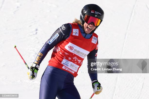 Sandra Naeslund of Sweden celebrates after crossing the finish line to win the Women's Ski Cross final of Audi FIS Cross World Cup 2022 at Genting...