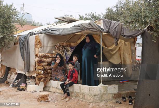 Syrians are seen as they live in makeshift tents amid olive trees at Tubaa refugee camp in Killi village of Idlib, Syria on November 26, 2021. Tubaa...