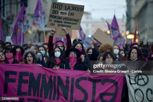 Protesters take part in a national demonstration of the movement "Non una di meno" demanding to end violence against women on November 27, 2021 in...