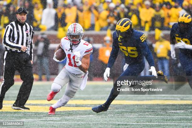 Ohio State Buckeyes wide receiver Jaxon Smith-Njigba takes a reception for a long gain during The Michigan Wolverines vs the Ohio State Buckeyes game...
