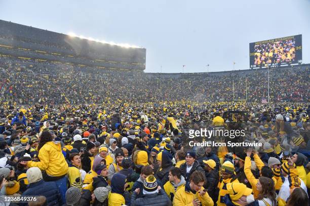 Michigan fans rush the field celebrating the 42-27 victory by The Michigan Wolverines vs the Ohio State Buckeyes game on Saturday November 27, 2021...