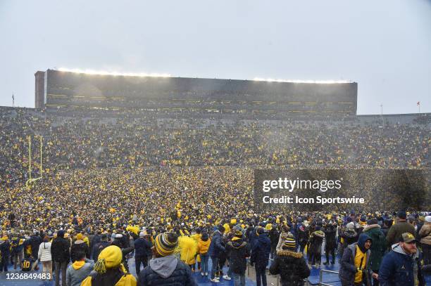 Michigan fans rush the field celebrating the 42-27 victory by The Michigan Wolverines vs the Ohio State Buckeyes game on Saturday November 27, 2021...