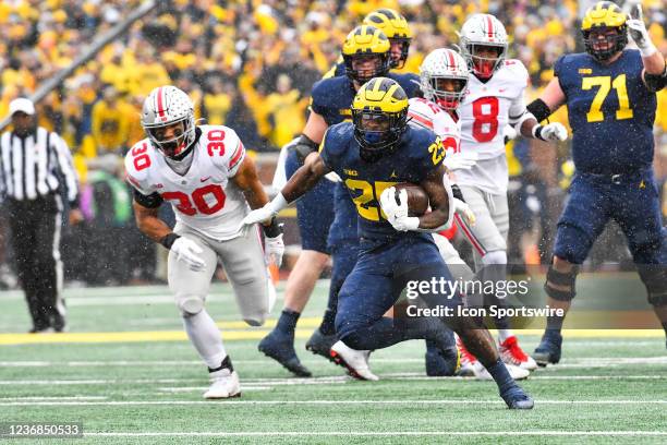 Michigan Wolverines running back Hassan Haskins rushes for a first down during The Michigan Wolverines vs the Ohio State Buckeyes game on Saturday...