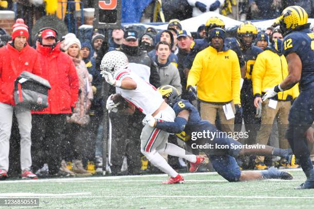 Ohio State Buckeyes wide receiver Jaxon Smith-Njigba makes a nice reception as hes tackled by Michigan Wolverines defensive back R.J. Moten during...