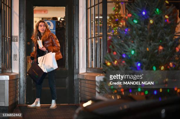 Natalie Biden, granddaughter of US President Joe Biden, walks out of Murray's Toggery Shop, in Nantucket, Massachusetts on November 27, 2021.