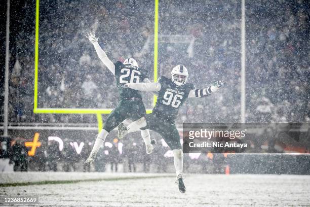 Brandon Wright and Jacub Panasiuk of the Michigan State Spartans celebrate against the Penn State Nittany Lions during the fourth quarter at Spartan...