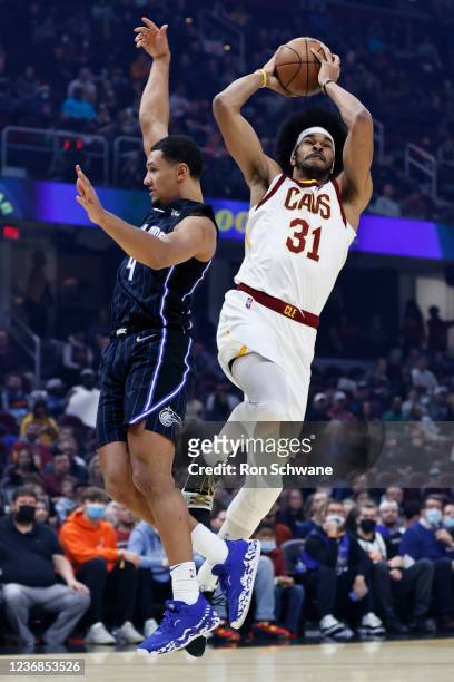 Jarrett Allen of the Cleveland Cavaliers goes up for a dunk against Jalen Suggs of the Orlando Magic during the first half at Rocket Mortgage...