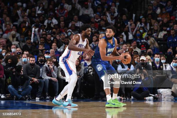 Joel Embiid of the Philadelphia 76ers plays defense against Karl-Anthony Towns of the Minnesota Timberwolves on November 27, 2021 at Wells Fargo...