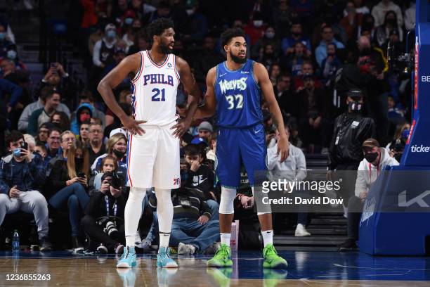 Joel Embiid of the Philadelphia 76ers and Karl-Anthony Towns of the Minnesota Timberwolves look on during a game on November 27, 2021 at Wells Fargo...