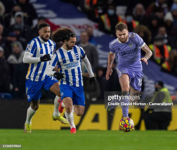 Leeds United's Stuart Dallas under pressure from Brighton & Hove Albion's Jurgen Locadia and Marc Cucurella during the Premier League match between...