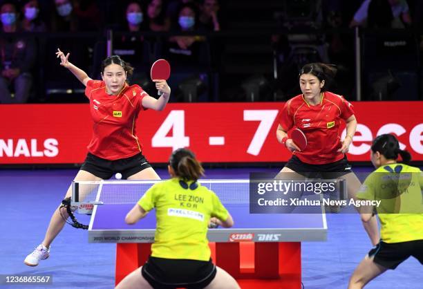 Chen Meng R top/Qian Tianyi L top of China compete during the women's doubles quarterfinal match against Choi Hyojoo/Lee Zion of South Korea at 2021...