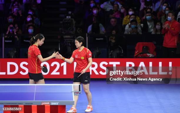 Chen Meng R/Qian Tianyi of China react during the women's doubles quarterfinal match against Choi Hyojoo/Lee Zion of South Korea at 2021 World Table...
