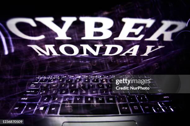 'Cyber monday' sign displayed on a laptop screen is seen in this multiple exposure illustration photo taken in Krakow, Poland on November 28, 2021.