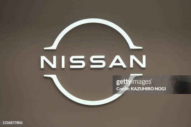 This photo taken on November 28, 2021 shows the logo of Japan's Nissan Motor at a car showroom in Tokyo.