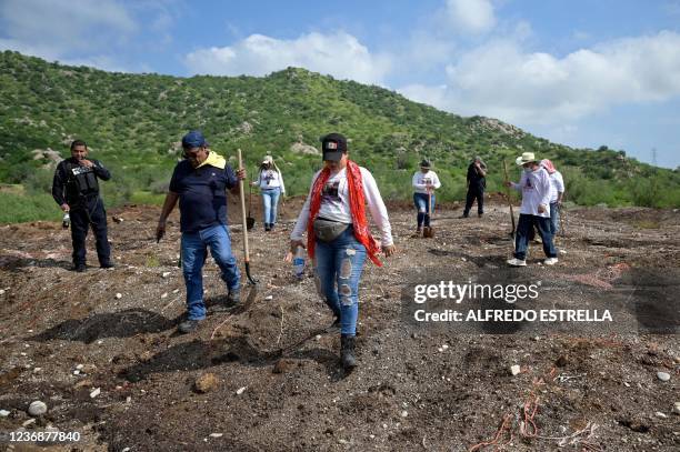 Members of the Madres Buscadoras de Sonora civil organization search for human remains in the outskirts of Hermosillo, Sonora state, Mexico, on...