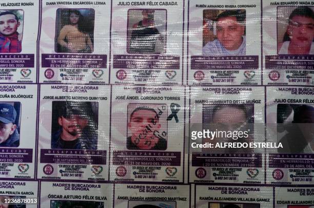 View of a poster with the names and photos of disappeared people at the offices of the Madres Buscadoras de Sonora civil organization in Hermosillo,...