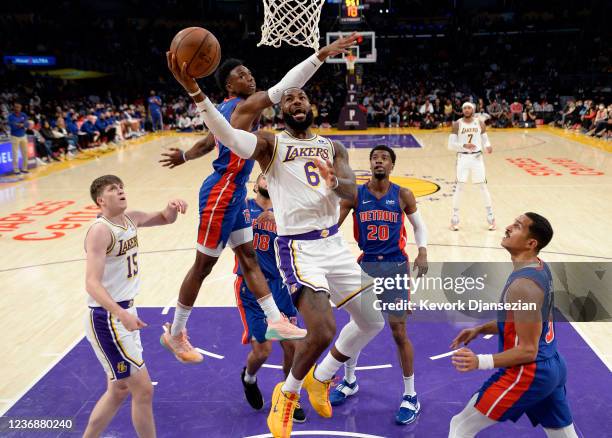 LeBron James of the Los Angeles Lakers drives to the basket ahead of Hamidou Diallo of the Detroit Pistons during the first half at Staples Center on...