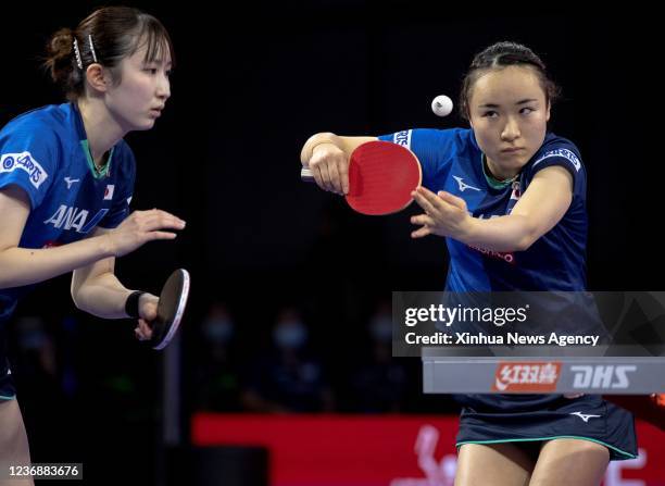 Japan's Ito Mima R/Hayata Hina compete during the women's doubles semifinal match against China's Chen Meng/Qian Tianyi at 2021 World Table Tennis...