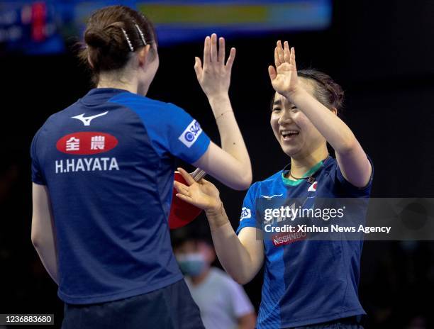 Japan's Ito Mima R/Hayata Hina react during the women's doubles semifinal match against China's Chen Meng/Qian Tianyi at 2021 World Table Tennis...