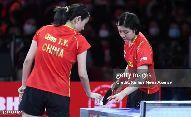 China's Chen Meng R/Qian Tianyi compete during the women's doubles semifinal match against Japan's Ito Mima/Hayata Hina at 2021 World Table Tennis...