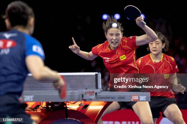 China's Chen Meng R/Qian Tianyi C compete during the women's doubles semifinal match against Japan's Ito Mima/Hayata Hina at 2021 World Table Tennis...