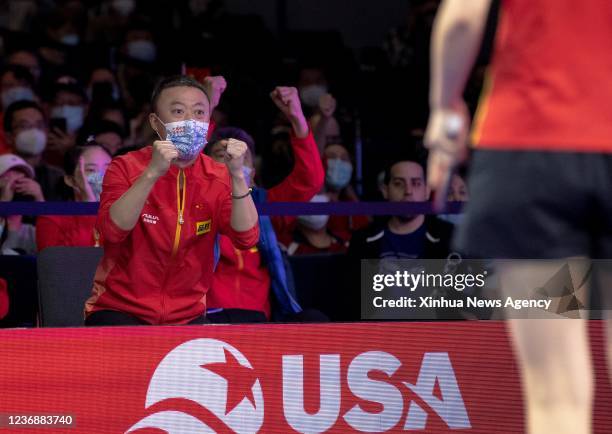 China's coach Ma Lin cheers during the women's doubles semifinal match between China's Chen Meng/Qian Tianyi and Japan's Ito Mima/Hayata Hina at 2021...