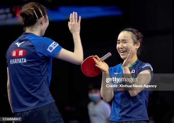 Japan's Ito Mima R/Hayata Hina react during the women's doubles semifinal match against China's Chen Meng/Qian Tianyi at 2021 World Table Tennis...