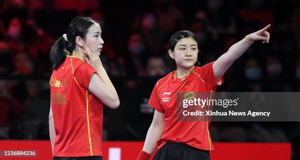 China's Chen Meng R/Qian Tianyi react during the women's doubles semifinal match against Japan's Ito Mima/Hayata Hina at 2021 World Table Tennis...