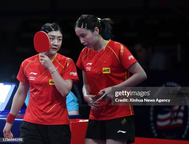 China's Chen Meng L/Qian Tianyi compete during the women's doubles semifinal match against Japan's Ito Mima/Hayata Hina at 2021 World Table Tennis...