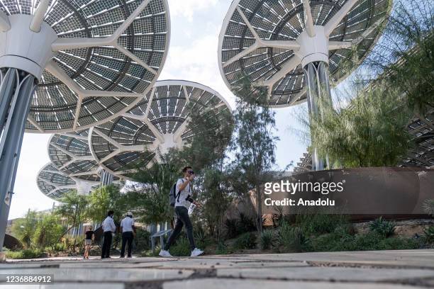 People walk by the Terra Pavilion at Dubai EXPO 2020 on November 29, 2021 in Dubai, United Arab Emirates.