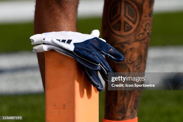 Gloves sit on the top of a scoring pylon as players warm up before the NFL game between the Los Angeles Chargers and the Denver Broncos on November...