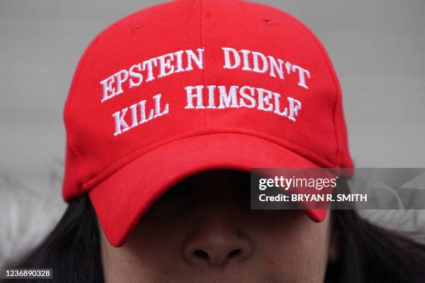 Eva Policastro protests outside the Thurgood Marshall United States Courthouse as the trial of Ghislaine Maxwell begins in New York on November 29,...