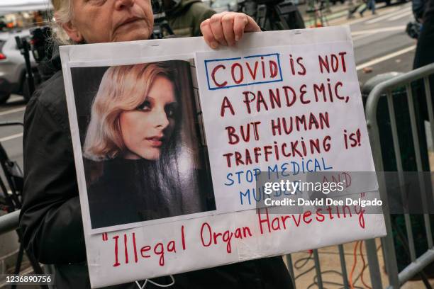 People gather to protest human trafficking at the Thurgood Marshall United States Courthouse where the trial of Ghislaine Maxwell is being held on...