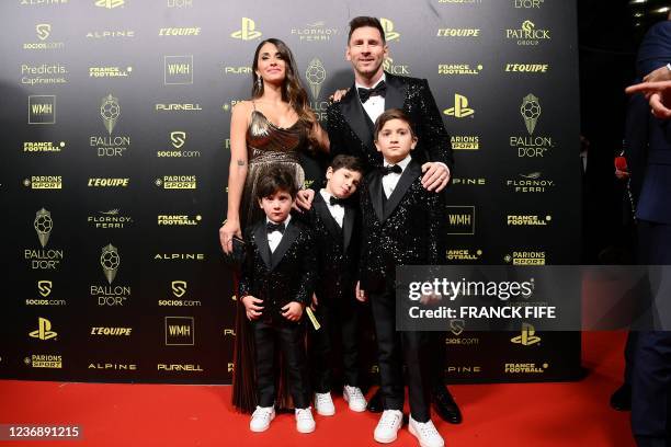 Paris Saint-Germain's Argentine forward Lionel Messi , his wife Antonella Roccuzzo , and their children Ciro, Mateo and Thiago pose upon arrival to...