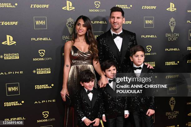 Paris Saint-Germain's Argentine forward Lionel Messi , his wife Antonella Roccuzzo , and their children Ciro, Mateo and Thiago pose upon arrival to...