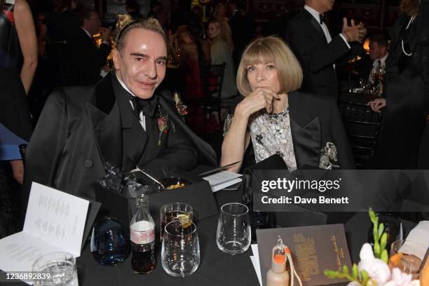 John Galliano and Editor-In-Chief of American Vogue and Chief Content Officer of Conde Nast Dame Anna Wintour attend a cocktail reception ahead of...