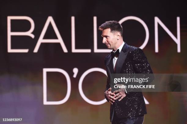 Paris Saint-Germain's Argentine forward Lionel Messi arrives to deliver a speech after being awarded the Ballon d'Or award during the 2021 Ballon...