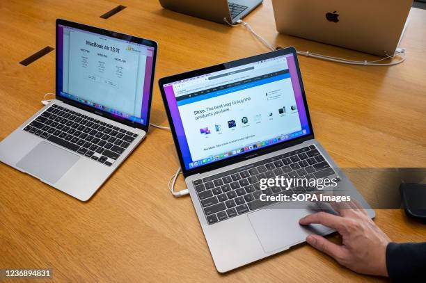 Shopper is seen using a Macbook Pro computer at an Apple store in Hong Kong.