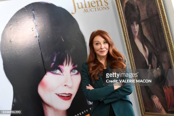 Actress Cassandra Peterson better know as Elvira, Mistress of the Dark, poses among memorabilia during the media preview of Julien's Auctions year...